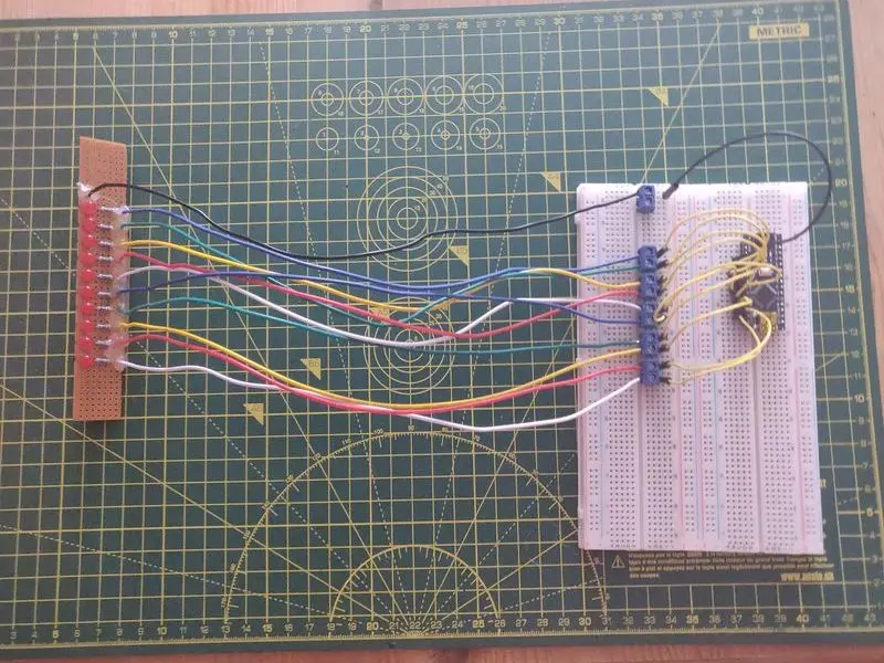 The completed LED board with resistors and wire in place connected to a breadboard and being tested using the Arduino.