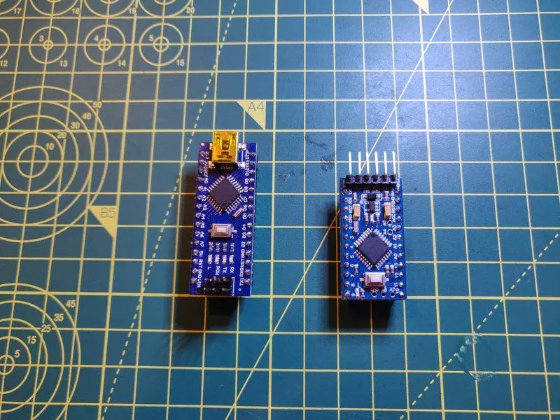 An Arduino Mini next to and Arduino Nano. Choosing which to use is the start of the Larson scanner build.