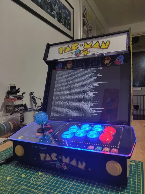 Booting the cabinet with the console fully assembled showing the buttons illuminated.